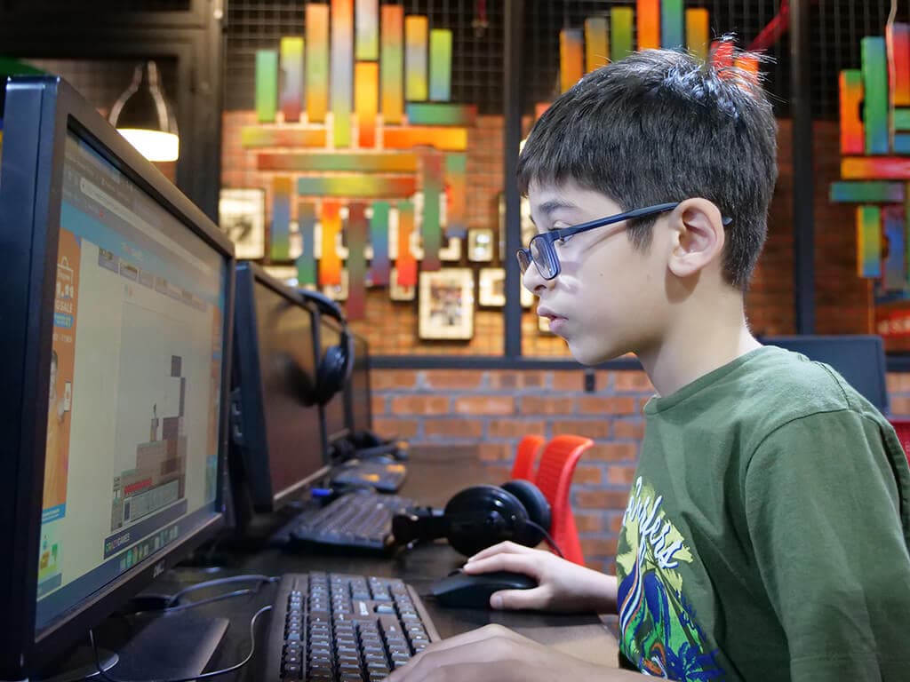 Kidocode student debugging a small game project